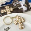 Gold Cross key chain with a Hampton link design from fashioncraft