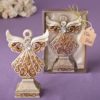 Antique ivory angel statue with a matte gold filigree detailing from fashioncraft