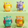 Multicolored ceramic owl banks