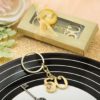 50th design gold metal key chain from fashioncraft