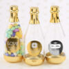 Personalized metallics gold accented clear champagne bottle container