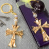 Ornate Flared cross keychain with a gold finish